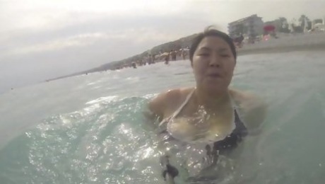 Asian wife in swimsuit big tits