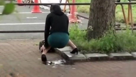Beautiful Asian girl accidentally pisses in publi