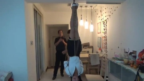 Asian tied upside down