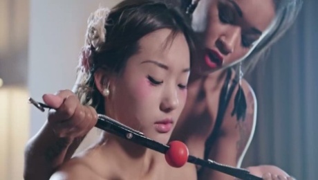 Two lesbians make use of ball gag and strapon to punish Chinese babe Alina Li