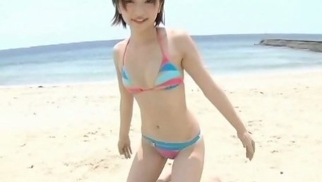Pale skinny sexy model Ryoko Tanaka has some fun on the beach